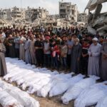112 LAID TO REST IN GAZA: A MASS FUNERAL NEARLY THREE YEARS AFTER THEIR FAMILIES WERE BURIED BENEATH